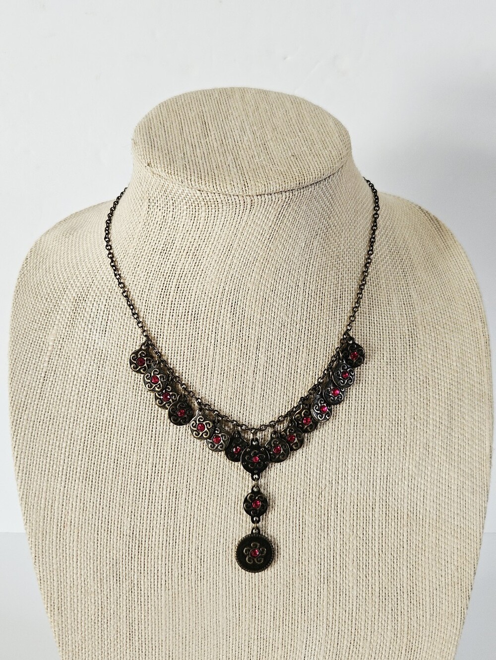 Vintage Avon Signed NRT Antiqued Brass Red Rhinestone Coin Charm Drop Necklace
